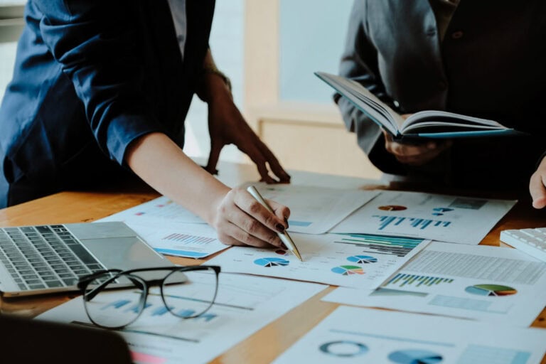 Business people planning, strategising & analysing
