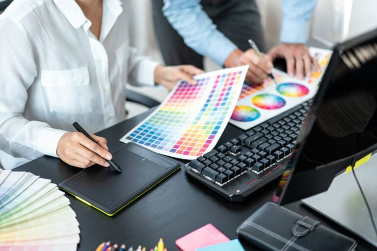 two creative graphic designers working on a color scheme